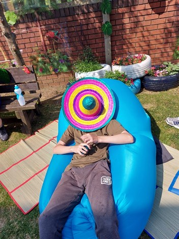 Student On Beanbag With Hat