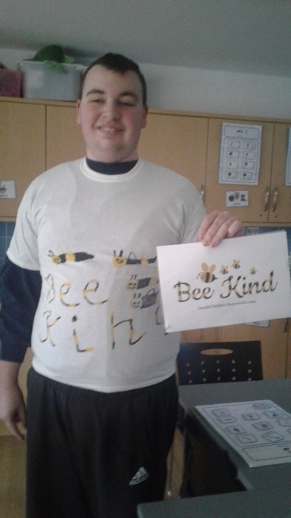 Student Wearing Bee Kind T Shirt