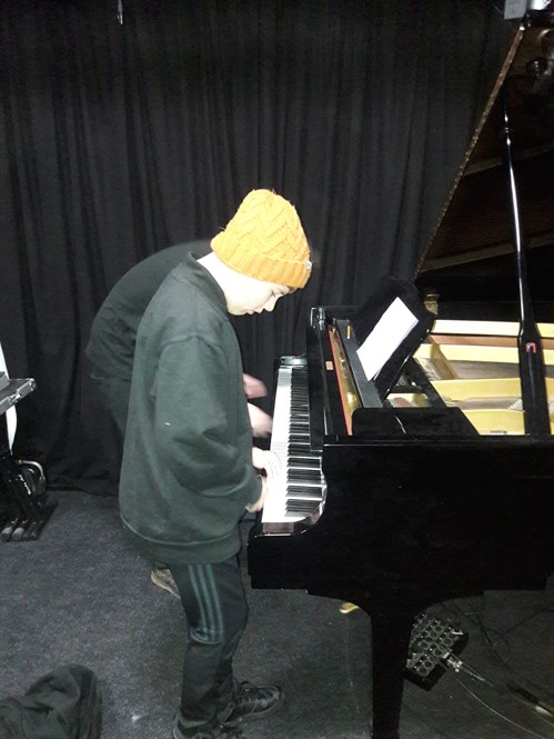 Male Student Playing Piano