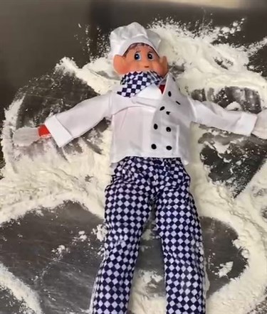 Elf Making Snow Angels