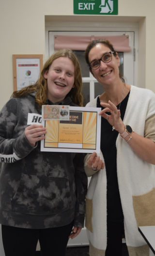 Female Student Holding Certificate With Female Staff Memberjpg 2 