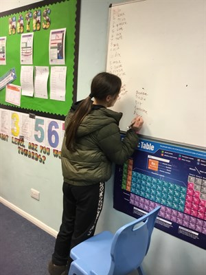 Female Student Writing French Words