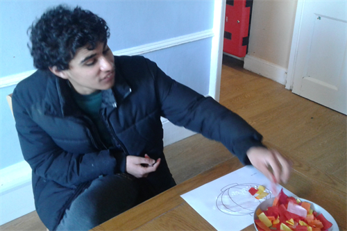 Male Student Decorating CNY Mask