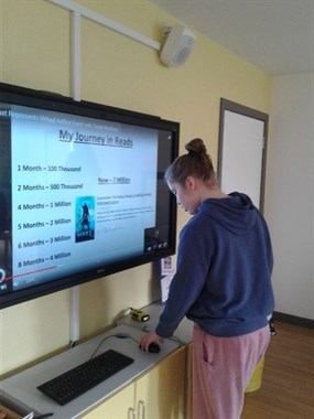 Virtual Book Event Female Student Using Computer