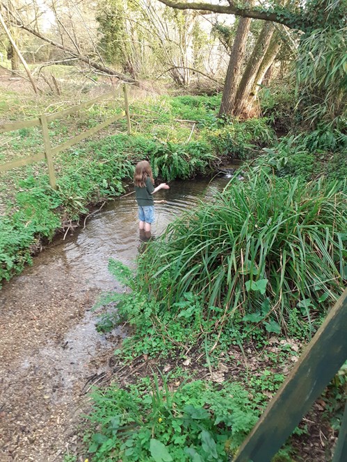 External The Forum School Female Student Standing In The River 1 Web