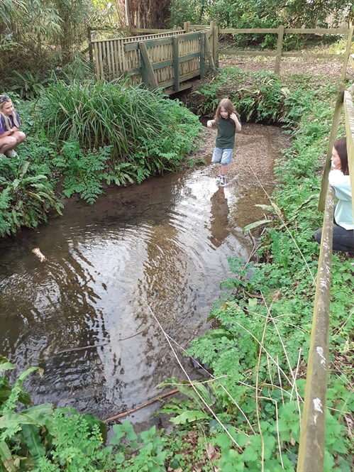 External The Forum School Female Student Standing In The River 2 Web