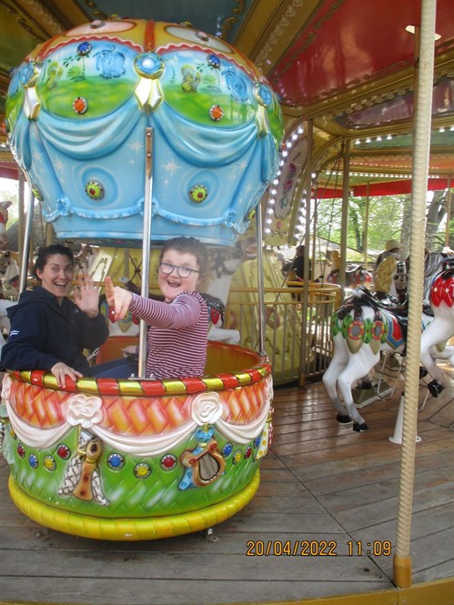 Female Student And Staff On Fair Ride