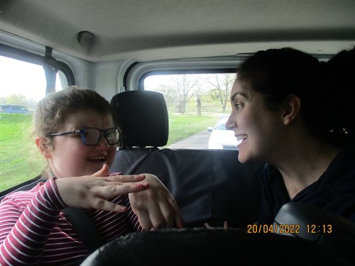 Student And Staff Smiling In Safari Car