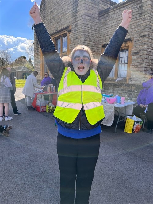 Student Smiling With Face Painted