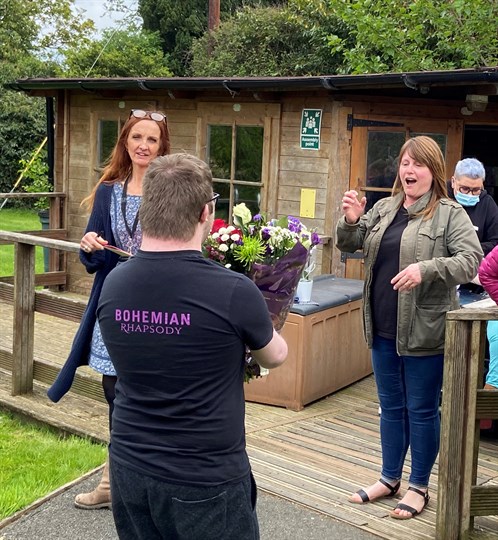 Student Surprising Rachel With Flowers