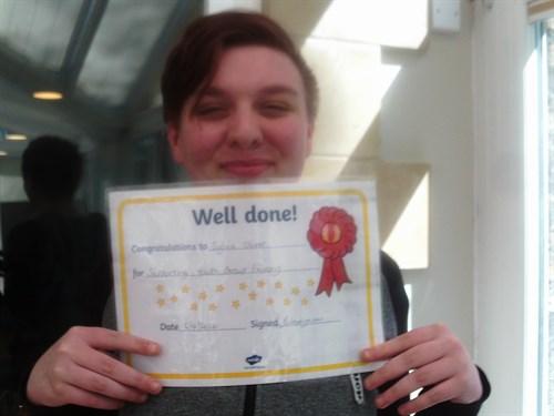 Student Holding Certificate