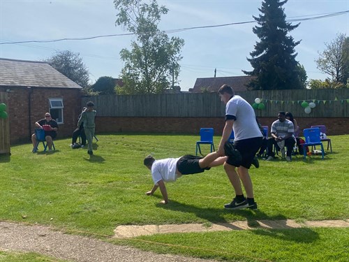 Students In Wheel Barrow Race