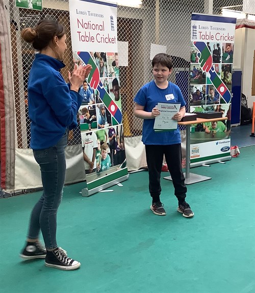 Spring Hill Student Receiving Certificate For Table Cricket