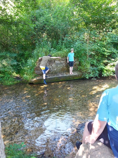 Scarborough Dalby Forest Students Walking Through Pond