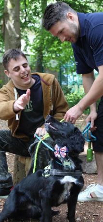 Hill House Walking The Dog Student Petting Dog