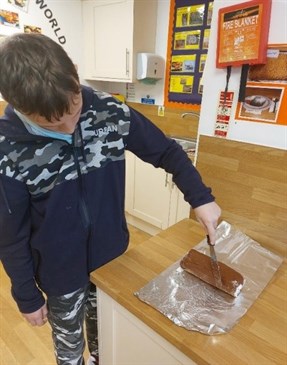 Student Making Yule Log