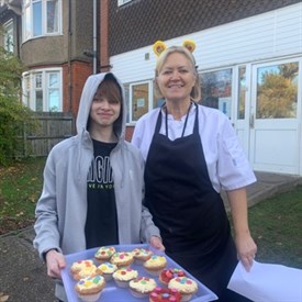 CIN Cake Decorating Student And Staff With Cake