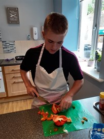 Student Chopping Food