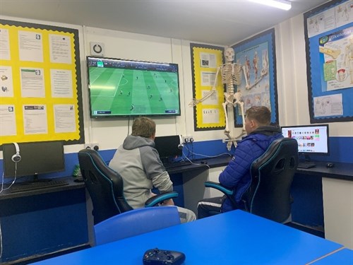 Two Students Playing FIFA