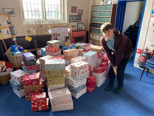 Student With Xmas Boxes