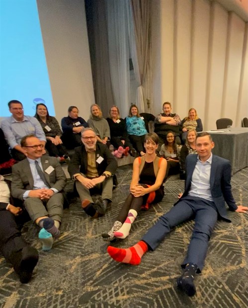 Group Of Staff Wearing Odd Socks