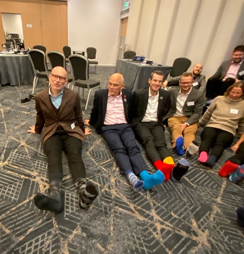 Senior Team Members Wearing Odd Socks