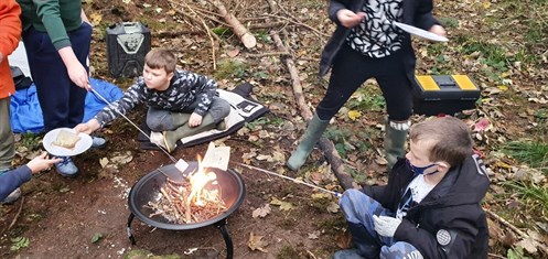 Students Toasting Bread And Marshmellows