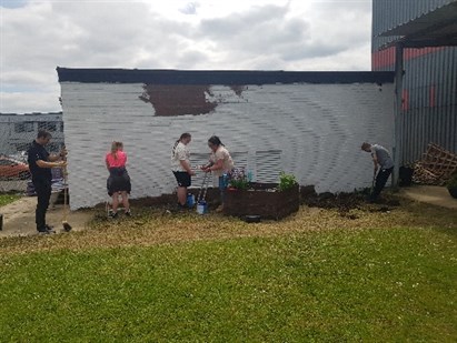 Hartlepool Group Of Students Painting Wall White