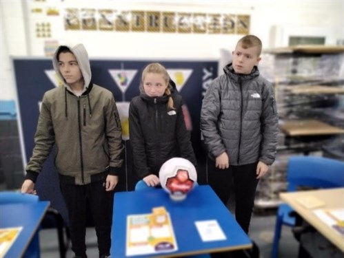 Group Of Students Managing Stall