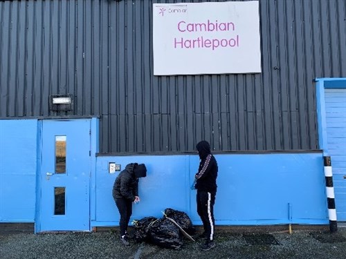 Hartlepool Two Male Students Getting Ready To Litter Pick