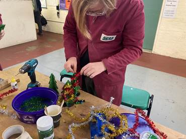 Student Working On Christmas Tree