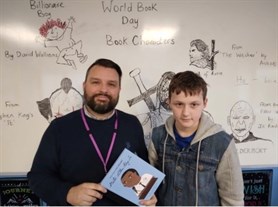 World Book Day Student And Staff With Chosen Book