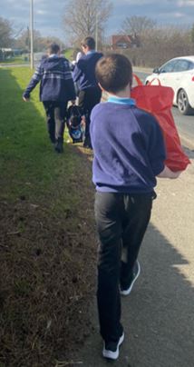 Ukraine Appeal Student Walking With Bag Of Donations