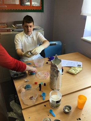 Male Student Making Bath Bomb On Science Day