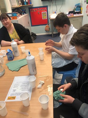 Male Student Making Slime On Science Day