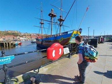 Red Nose Day Student Looking At Boats In The Harbour