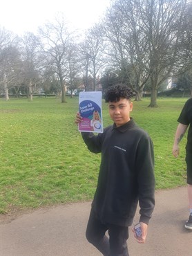 Super 60 Challenge Student Holding Super 60 Challenge Info Pack