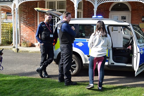 Grateley School Student Speak To Pcsos Around A Police Car