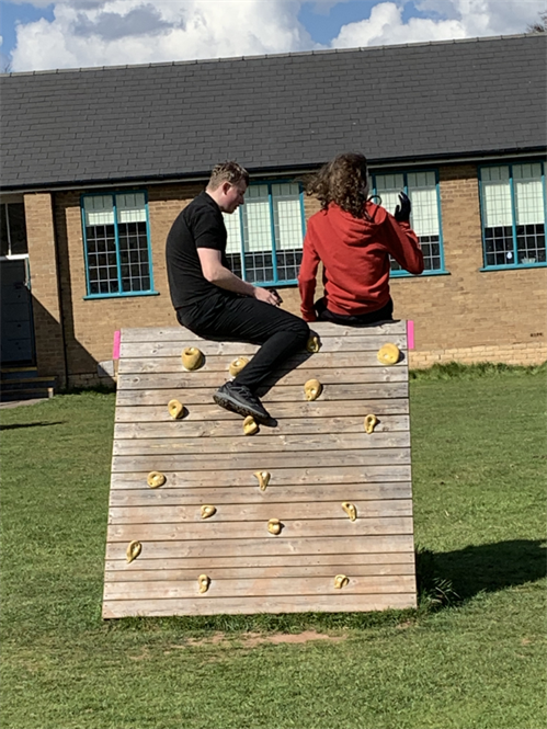 Students On Outdoor Play Equipment