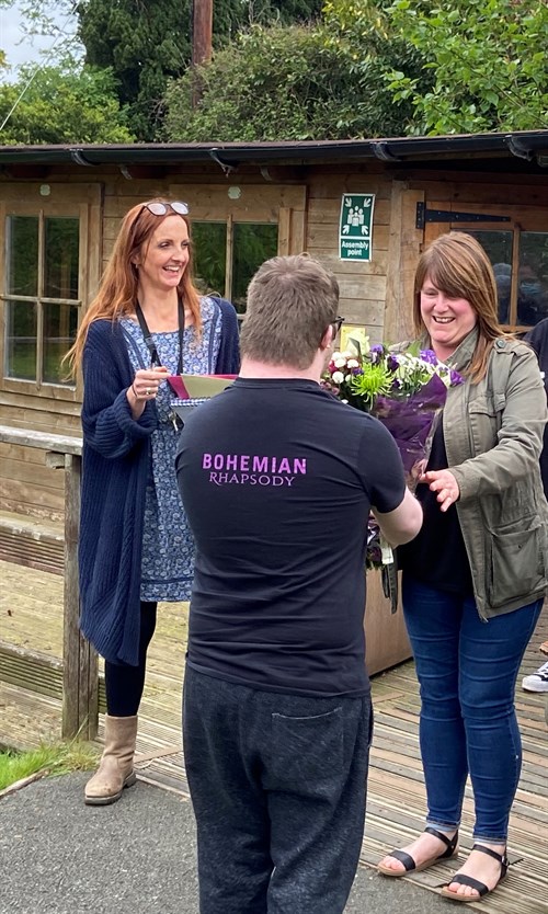 Student Presents Flowers