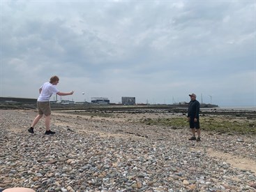 Exam Season Treat Student And Staff Playing Catch On The Beach