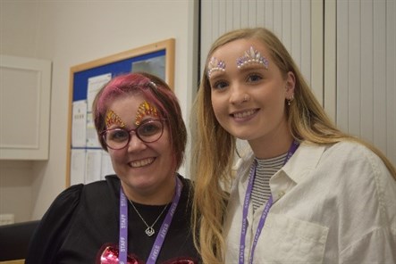 Sparkle Day Two Staff Members Smiling With Face Glitter