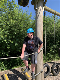 NES NCS Male Student On Ropes Course