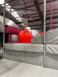 Ninja Warrior Student On Bouncy Ball