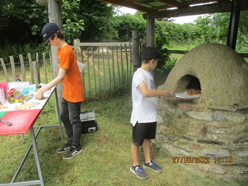 Project Week Students Cooking Pizzas Outside