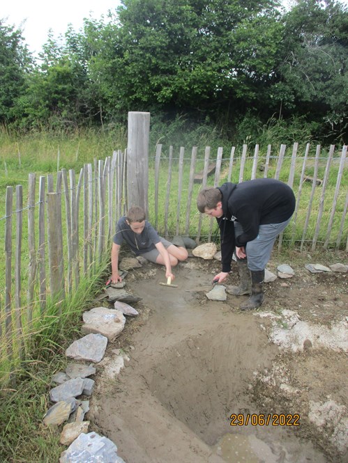 Project Week Students Finishing Off School Pond