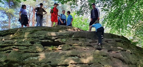 Scarborough Dalby Forest Students Climbing Large Rock