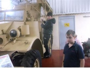 Muckleburgh Military Museum Student Exploring Military Vehicle