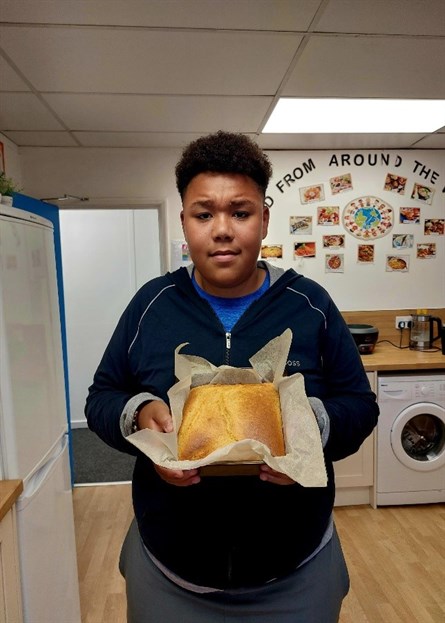 BHM Student Smiling With His Baking