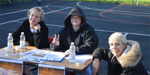 Basketball Tournament Student And Staff Keeping Score